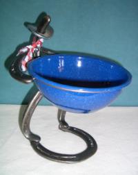Horse shoes cowboyholding candy bowl Statue